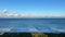 A time lapse of the Atlantic Ocean with with lapping waves and clouds and boats going by