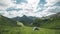 Time-lapse of the Austrian alps. Camping with a tent and watching clouds move by quickly between the mountains