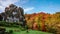 Time Lapse-Autumn colors as clouds blow past alternating the scene between sunlight and shadow