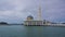 Time-lapse of beautiful floating mosque at Pangkor Island during sunrise. Zoom In effect.