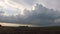 Time lapse of building tornadic thunderstorm over the dutch landscape at sunset
