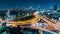 Time-lapse of car traffic transportation on highway road intersection in Bangkok city, Thailand at night