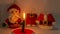 Time lapse of the Christmas candle that melts with the background of Santa Claus and his pants with a jacket