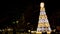 time lapse christmas tree in a square in europe with people