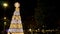 time lapse christmas tree in a square in europe with people