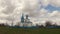 Time-lapse. Church against the sky with clouds in the spring