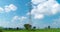 Time-lapse of clouds behind high voltage electric pole