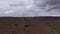 Time lapse of clouds hovering over hill