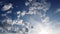 Time lapse clouds with layered white cirrocumulus clouds formation and blue sky