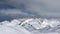 Time lapse of clouds moving over snow mountains.