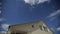 Time lapse of clouds over a roof of the big family house