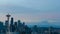 Time lapse of clouds and sunrise over Seattle WA with snow covered Mt. Rainier