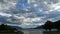 Time Lapse of cloudy blue sky at sunset above of Lake Maggiore.