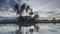 Time lapse coconut trees reflect in the water