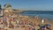 Time lapse of crowded sandy beach in Cascais near Lisbon, Portugal during the summer. This beach is known as Praia da