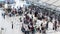 Time-lapse of crowded traveler people wait in queue at international airport check in counter in Thailand