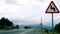 Time lapse of curling clouds above windy road in Sierra Nevada mountains, Spain