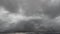 Time lapse of dark sky clouds background. The view from the drone traveling into the sky flying through the black clouds. Stormy c