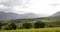 Time lapse of drifting clouds over wine farm during wind