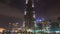 Time lapse of Dubai burj khalifa at night with Musical fountain . pan up