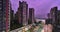 Time lapse of the evening city of Shenzhen, view of a busy street, busy traffic, residential high-rise buildings, flickering stree