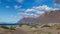 Time lapse of Famara beach, dunes of El Jable desert and Risco de Famara mountains, Spain