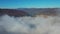 Time lapse of fluffy fog and autumn city, morning fog over the city  an beautiful landscape