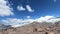 Time lapse of the foot of the sleeping Elbrus volcano with snow-capped peaks of the sky with moving shadows and clouds