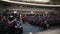 Time lapse of graduate students getting into assembly hall and taking seats