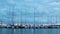 Time lapse from harbor in Palamos of Spain with many sailboats at the evening