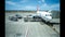 Time lapse hyperlapse of the loading and unloading of a tourist plane with the rollers and tank trucks and the crew