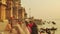 Time lapse Indian pilgrims rowing boat in sunrise. Ganges river at Varanasi India.
