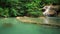 Time-lapse of Level 1 of Erawan Waterfall with Neolissochilus stracheyi fish in Kanchanaburi Province, Thailand