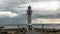 Time lapse with a lighthouse and moving clouds