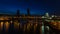 Time Lapse of Long Exposure Light Trails of Auto Traffic on Steel Bridge Across Willamette River at Blue Hour in Portland Oregon