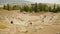 Time lapse of many visitors viewing remains of ancient Greek Theater of Dionysus