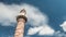 Time lapse of minaret of a mosque with moving clouds.