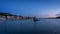 Time Lapse movie a sunset at Oslo Harbour with the floating sculpture `She Lies` in stainless steel and glass.