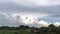 Time lapse of moving black clouds and blue sky before rain