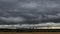 Time lapse - moving clouds over a field in autumn with Frankfurt am Main in the distance