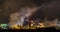 Time lapse of night industrial landscape environmental pollution waste of thermal power plant. Big pipes of chemical industry ente