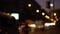 Time lapse night movement of cars and people out of focus