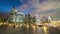 Time-lapse of people walk in business district Marina bay at night, office building view