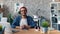 Time-lapse portrait of bearded man business owner smiling in office at desk