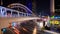 Time-lapse of public sky walk and traffic at Chong Nonsi sky train station at night, Bangkok, Thailand