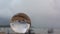 Time lapse raining on crystal ball on the beach.