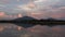 Time lapse reflection sunset with golden cloud, hills and sky