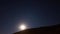 Time lapse of rising moon over the hills