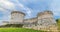 Time-lapse of ruins of medieval old tower of castle under blue sky with cloud in Matera, timelapse