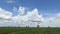 Time-lapse scenic landscape of moving clouds against blue sky and agriculture farm